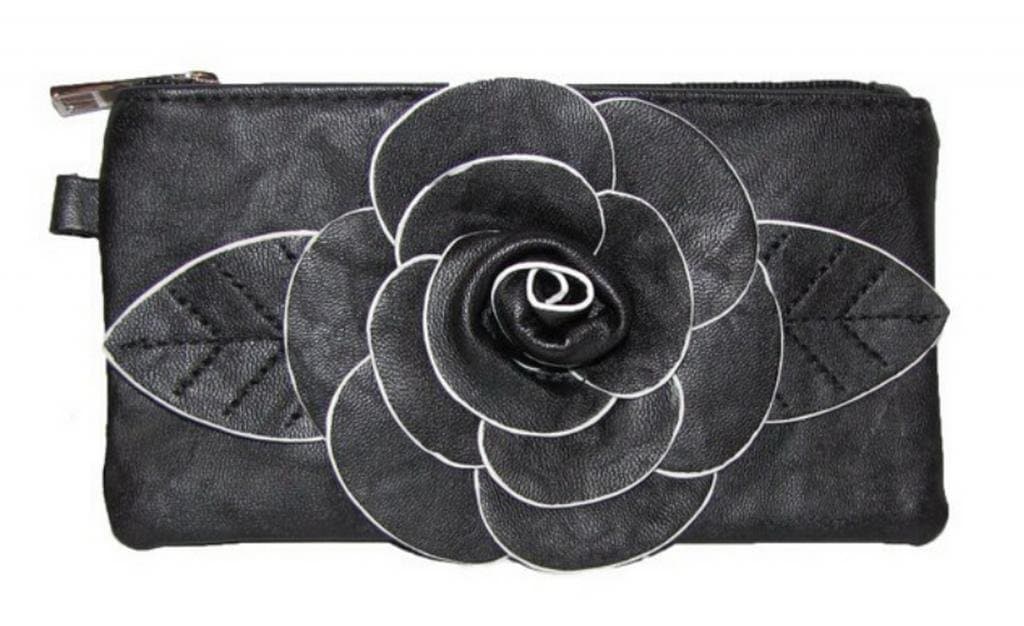 The compact purse is decorated with a single large flower